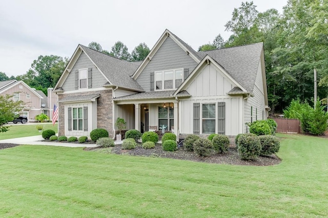 craftsman-style home with a front yard