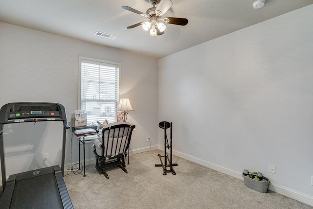 interior space with ceiling fan and light colored carpet