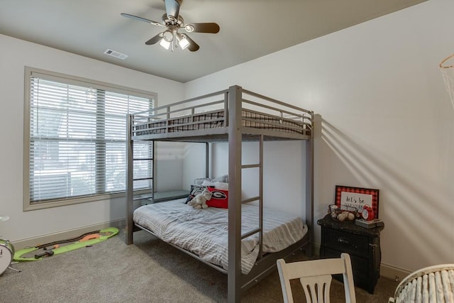 bedroom with ceiling fan and carpet