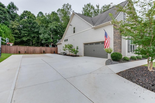 view of side of property featuring a garage