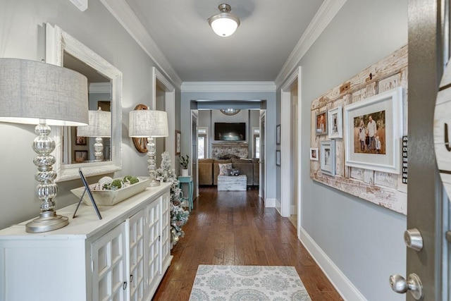 corridor with dark hardwood / wood-style flooring and ornamental molding