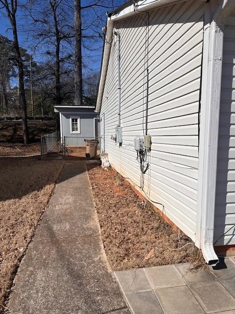 view of side of property with an outdoor structure