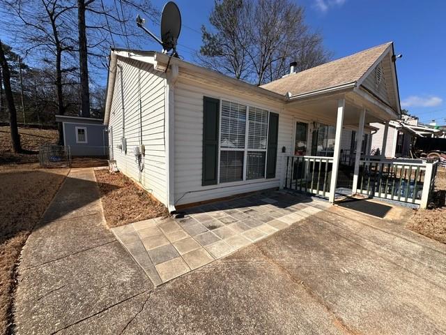 rear view of property featuring a patio