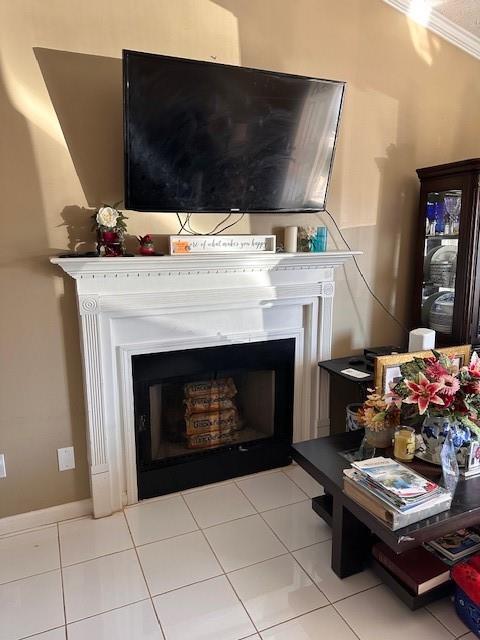 details with ornamental molding and a fireplace