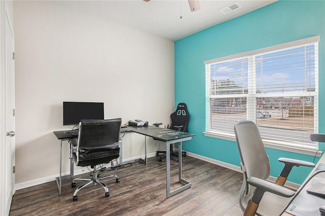 home office featuring a ceiling fan, baseboards, visible vents, and wood finished floors