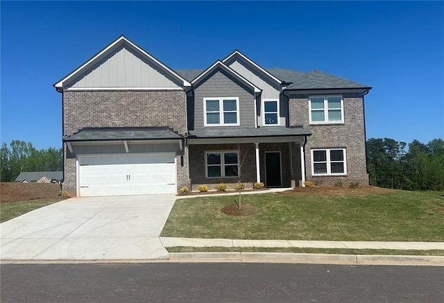 57 Longhorn Way, Auburn, GA 30011 - craftsman-style home with brick siding, driveway, a garage, and a front yard