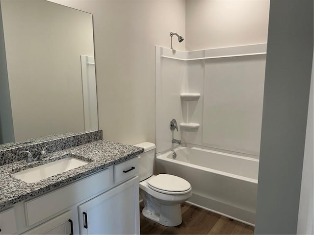 57 Longhorn Way, Auburn, GA 30011 - full bath with wood finished floors, toilet, vanity, and shower / washtub combination