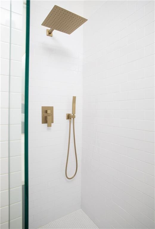 bathroom with a tile shower