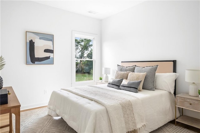 bedroom with light hardwood / wood-style flooring