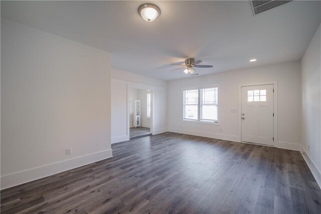 interior space featuring visible vents, dark wood-type flooring, a ceiling fan, recessed lighting, and baseboards