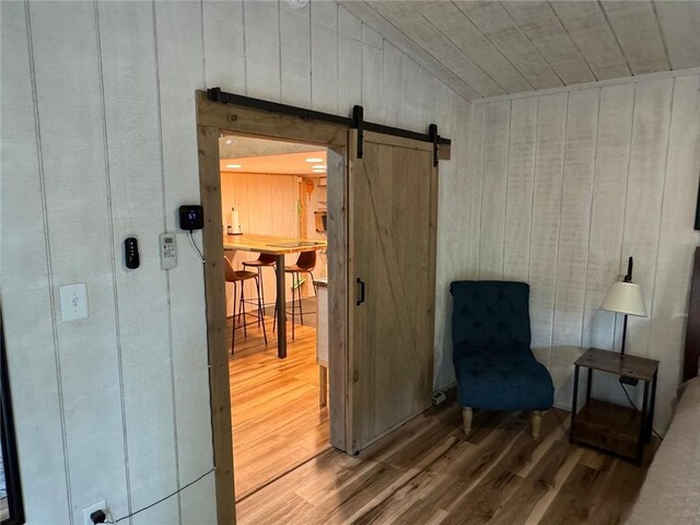 225 Overlook Cir, Clarkesville, GA 30523 - sitting room with a barn door, wood finished floors, wood walls, and wooden ceiling