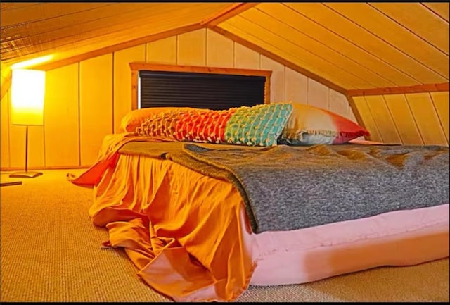 225 Overlook Cir, Clarkesville, GA 30523 - bedroom featuring carpet flooring, vaulted ceiling, and wood walls