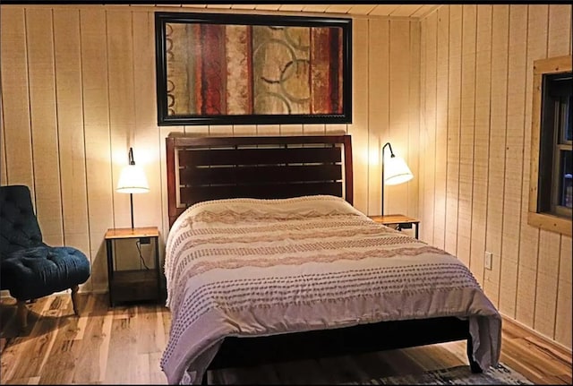 225 Overlook Cir, Clarkesville, GA 30523 - bedroom with wood finished floors and wooden walls
