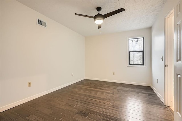 spare room featuring visible vents, a textured ceiling, baseboards, ceiling fan, and dark wood-style flooring