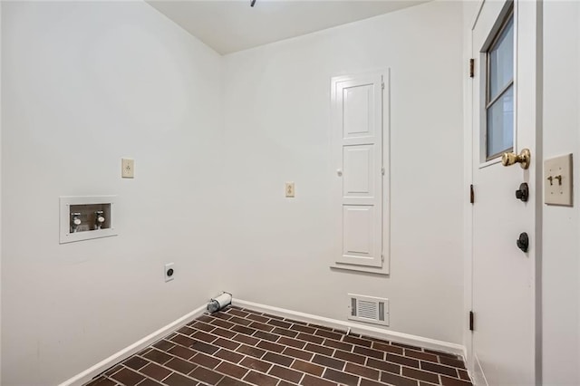 washroom with laundry area, brick floor, baseboards, and visible vents