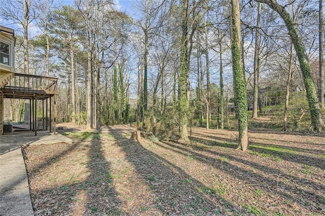 view of yard featuring a wooden deck