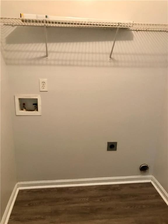 75 Oak Hill Dr, Covington, GA 30016 - washroom featuring hookup for an electric dryer, dark wood finished floors, baseboards, and hookup for a washing machine