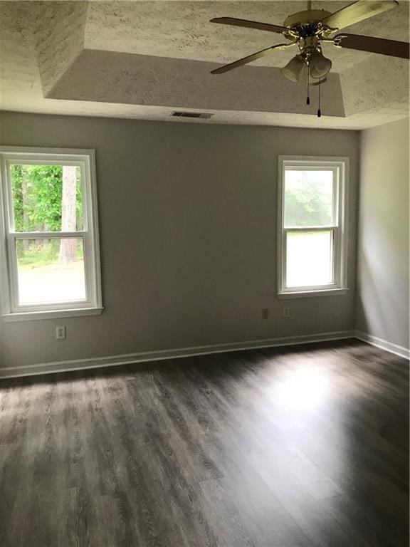 75 Oak Hill Dr, Covington, GA 30016 - unfurnished room with dark wood finished floors, baseboards, and a ceiling fan