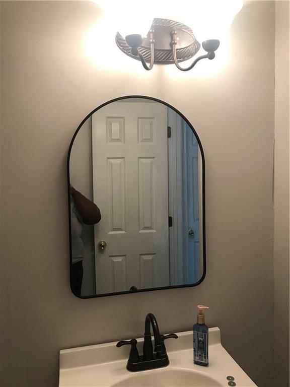 75 Oak Hill Dr, Covington, GA 30016 - bathroom featuring a sink