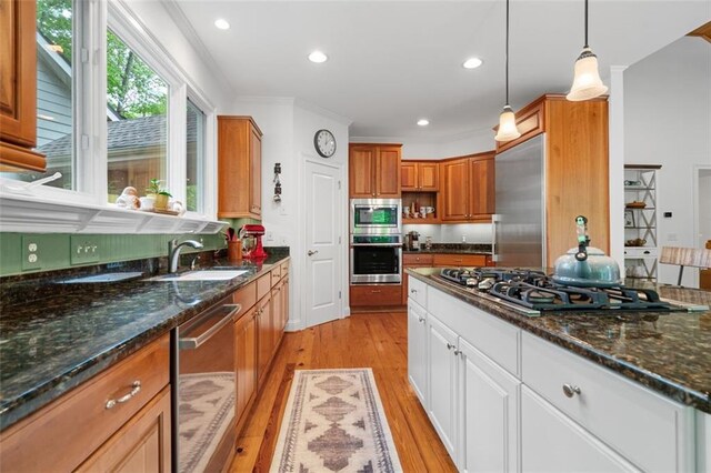 74 Cherokee Way, Big Canoe, GA 30143 - kitchen with a sink, light wood finished floors, built in appliances, brown cabinetry, and ornamental molding