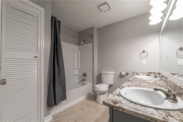 full bath featuring toilet, shower / bath combo, tile patterned floors, double vanity, and a textured ceiling