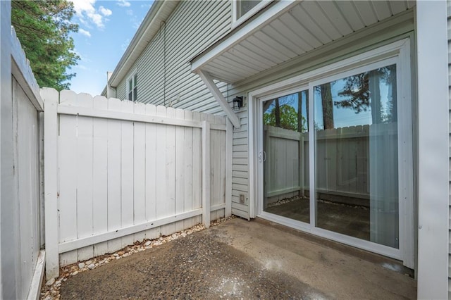 view of patio / terrace featuring fence