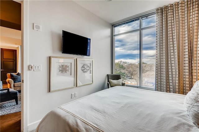 1820 Peachtree St NW Unit 811, Atlanta, GA 30309 - bedroom with baseboards and expansive windows