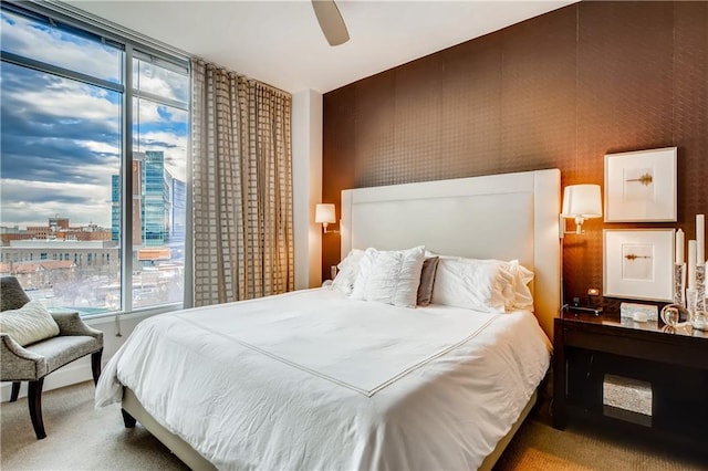 1820 Peachtree St NW Unit 811, Atlanta, GA 30309 - bedroom with carpet flooring, expansive windows, a city view, and a ceiling fan