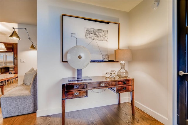 1820 Peachtree St NW Unit 811, Atlanta, GA 30309 - detailed view of wood finished floors, baseboards, and a smoke detector