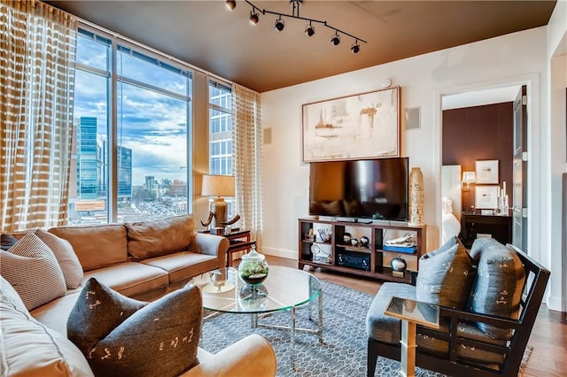 1820 Peachtree St NW Unit 811, Atlanta, GA 30309 - living room featuring wood finished floors, baseboards, and track lighting