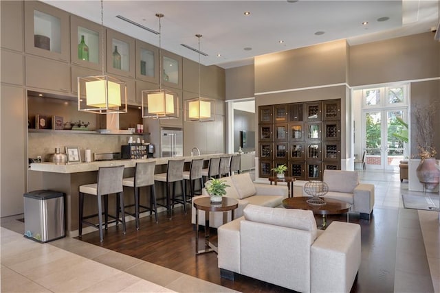 1820 Peachtree St NW Unit 811, Atlanta, GA 30309 - living room with a high ceiling, tile patterned floors, and recessed lighting