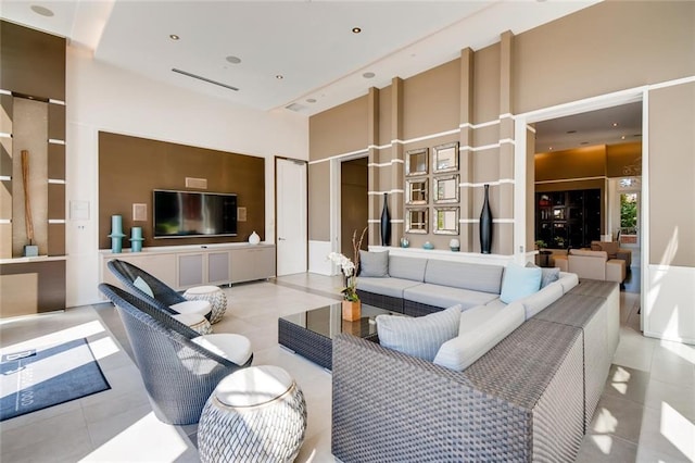1820 Peachtree St NW Unit 811, Atlanta, GA 30309 - living room with a towering ceiling and tile patterned floors