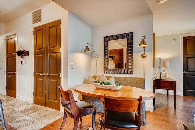 1820 Peachtree St NW Unit 811, Atlanta, GA 30309 - dining room featuring wood finished floors and baseboards