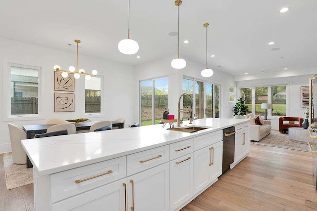 1598 Athens Ave, Atlanta, GA 30310 - kitchen featuring a sink, open floor plan, light wood-type flooring, white cabinets, and recessed lighting