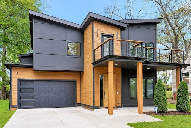 1598 Athens Ave, Atlanta, GA 30310 - modern home with a balcony, an attached garage, and concrete driveway