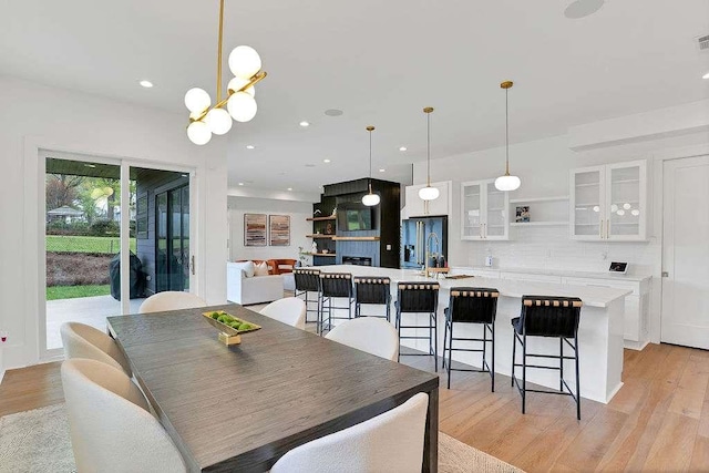 1598 Athens Ave, Atlanta, GA 30310 - dining room with light wood-style flooring, a chandelier, and recessed lighting