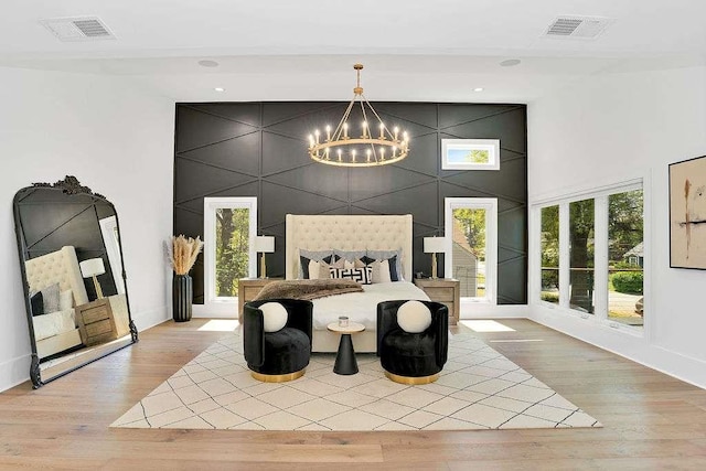 1598 Athens Ave, Atlanta, GA 30310 - bedroom featuring a notable chandelier, light wood finished floors, and visible vents