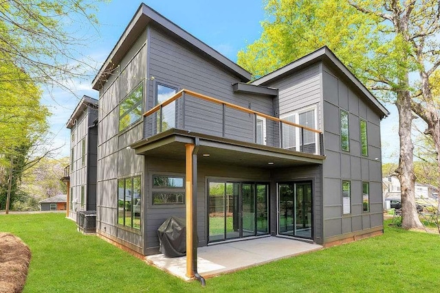 1598 Athens Ave, Atlanta, GA 30310 - rear view of house with a balcony, a patio area, central AC unit, and a yard