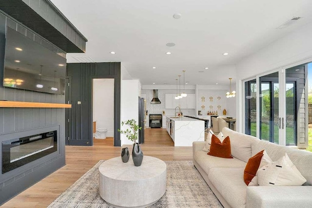 1598 Athens Ave, Atlanta, GA 30310 - living area featuring light wood-style floors, a fireplace, and recessed lighting