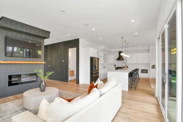 1598 Athens Ave, Atlanta, GA 30310 - living area with recessed lighting, a glass covered fireplace, and light wood-type flooring