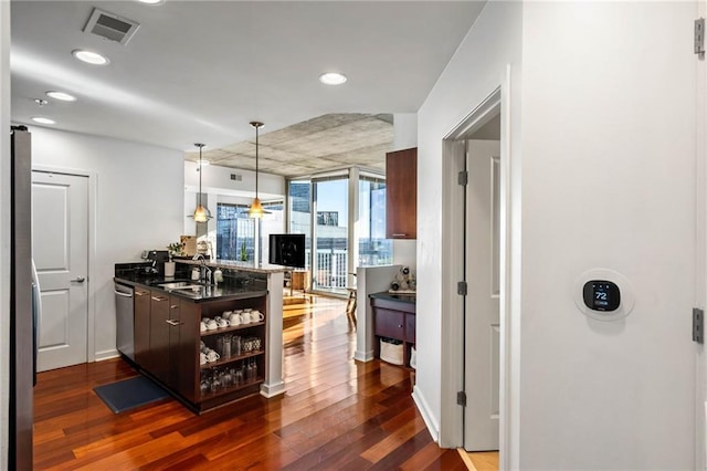 kitchen featuring sink, appliances with stainless steel finishes, and dark hardwood / wood-style flooring