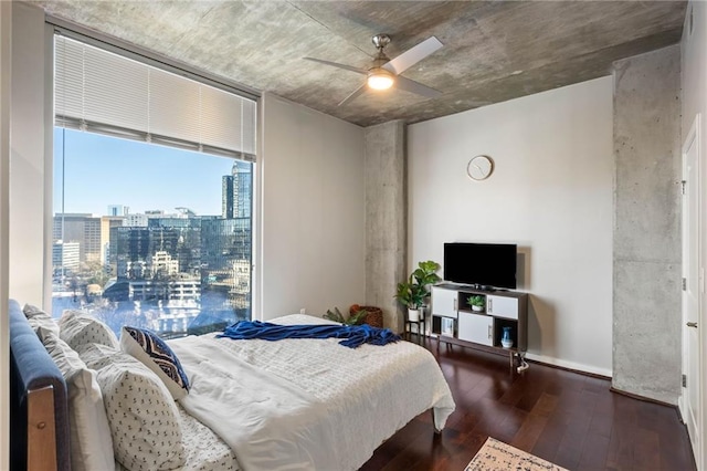 bedroom with ceiling fan and dark hardwood / wood-style flooring