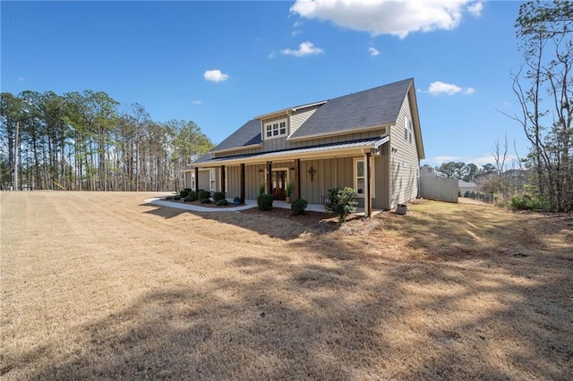 back of house featuring a porch and board and batten siding