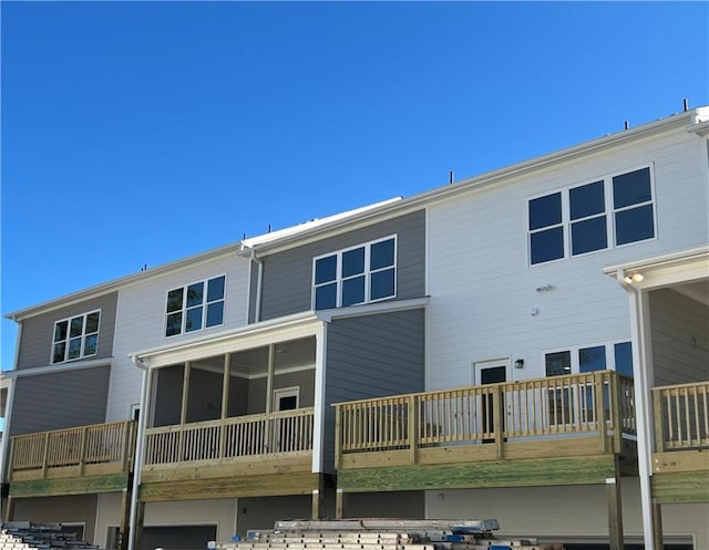 back of property featuring a sunroom