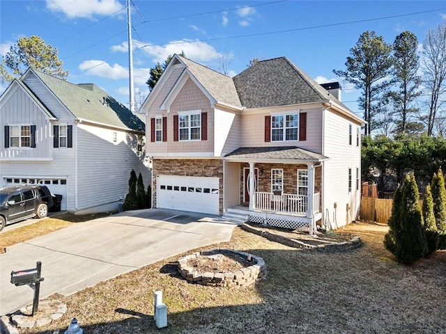 view of front of house with a garage and covered porch