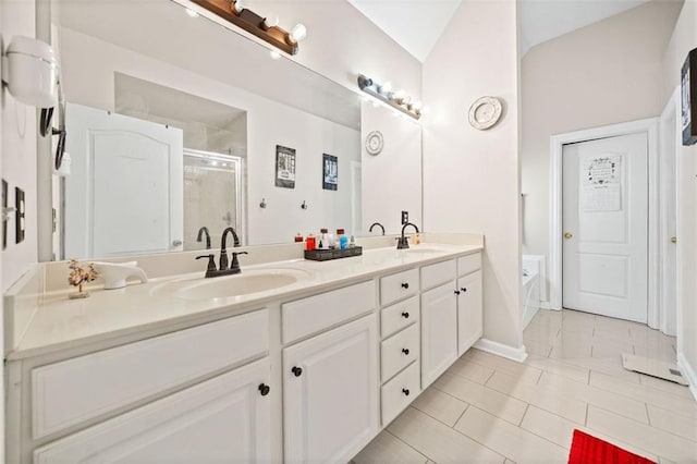 bathroom with vanity, tile patterned flooring, and a shower with door