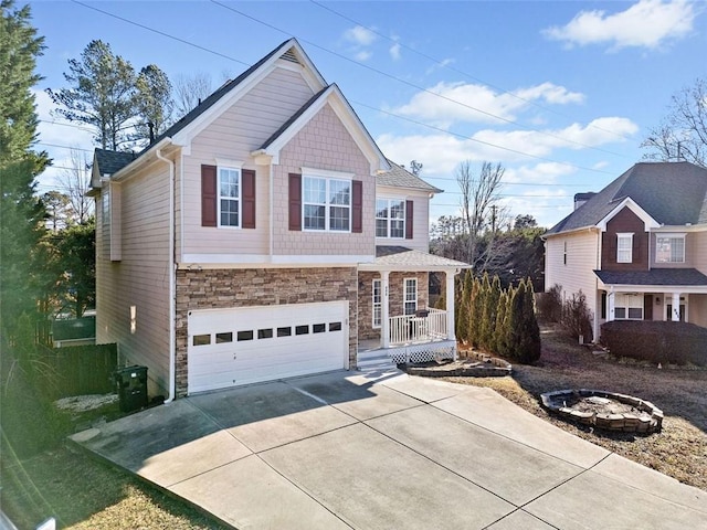 view of front of property featuring a garage and covered porch