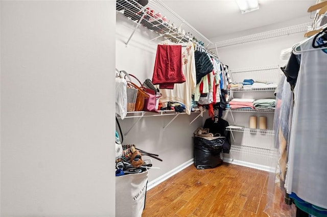 walk in closet featuring hardwood / wood-style floors