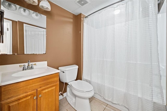 full bathroom with shower / bath combination with curtain, vanity, tile patterned floors, and toilet