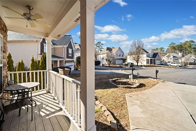 exterior space featuring ceiling fan and a porch